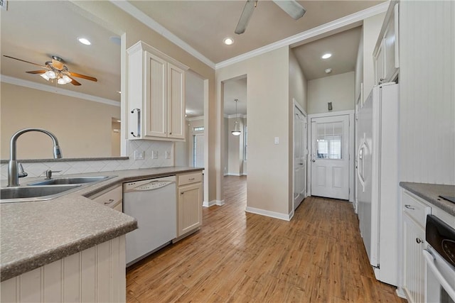 kitchen with ceiling fan, light hardwood / wood-style floors, white appliances, and sink