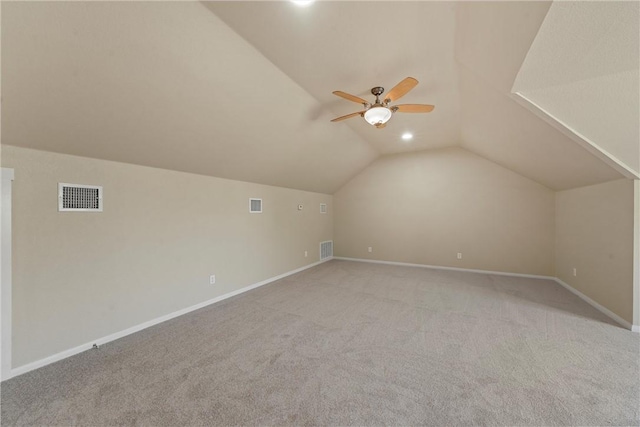 bonus room with light carpet, vaulted ceiling, and ceiling fan