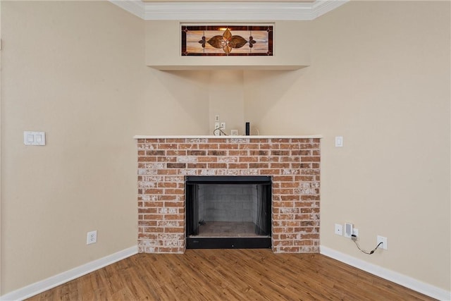 room details featuring wood-type flooring, ornamental molding, and a brick fireplace