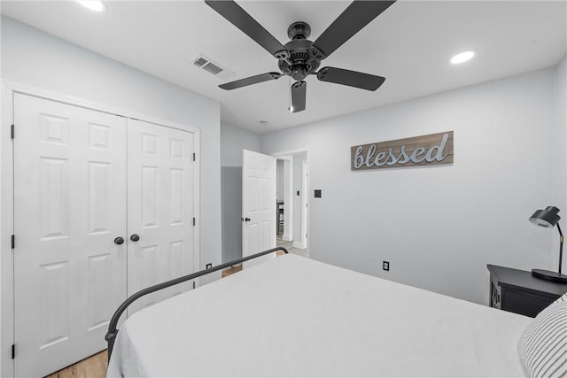 bedroom with recessed lighting, a closet, visible vents, a ceiling fan, and light wood-style floors