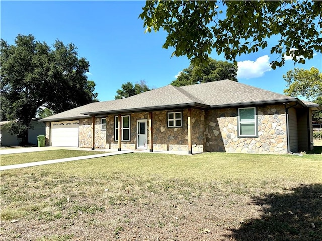 ranch-style house featuring a front yard and a garage