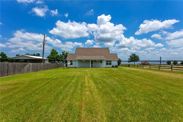 rear view of house with a lawn