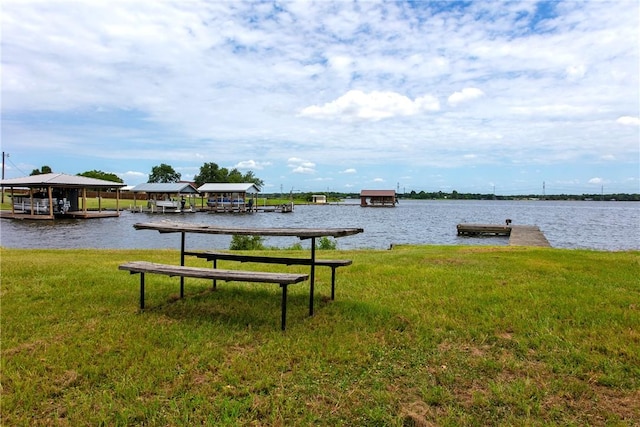 exterior space with a yard and a water view