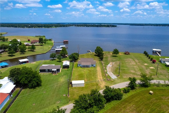 birds eye view of property with a water view