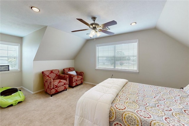 bedroom with ceiling fan, light carpet, and vaulted ceiling