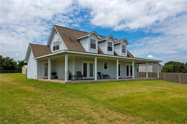 back of house with a yard and french doors