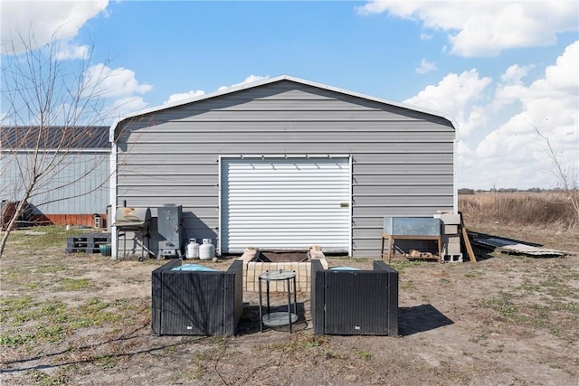 view of outbuilding with a garage