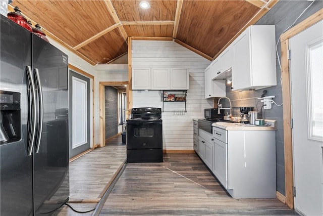 kitchen featuring dark hardwood / wood-style floors, black electric range oven, white cabinets, refrigerator with ice dispenser, and wooden ceiling