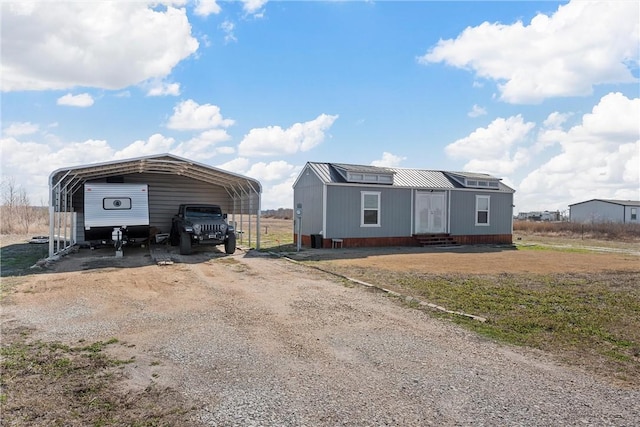 exterior space with a carport