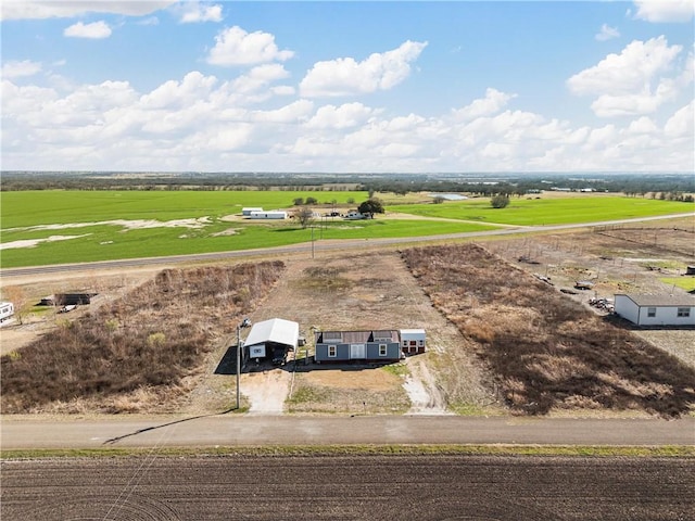 birds eye view of property featuring a rural view