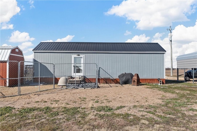 back of property with a shed