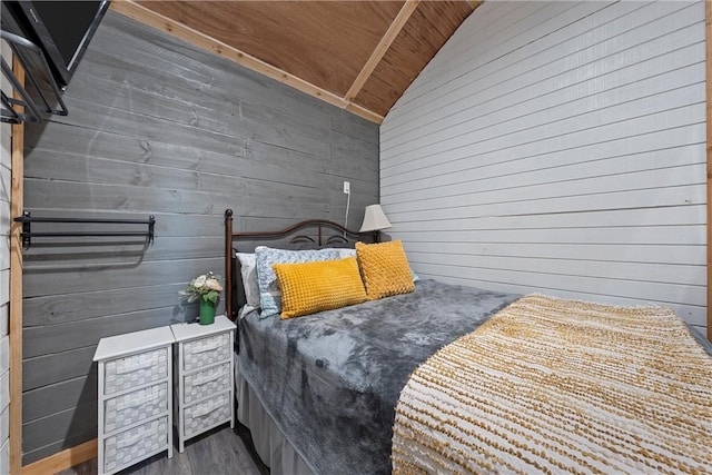 bedroom featuring wooden ceiling, lofted ceiling, and wood walls