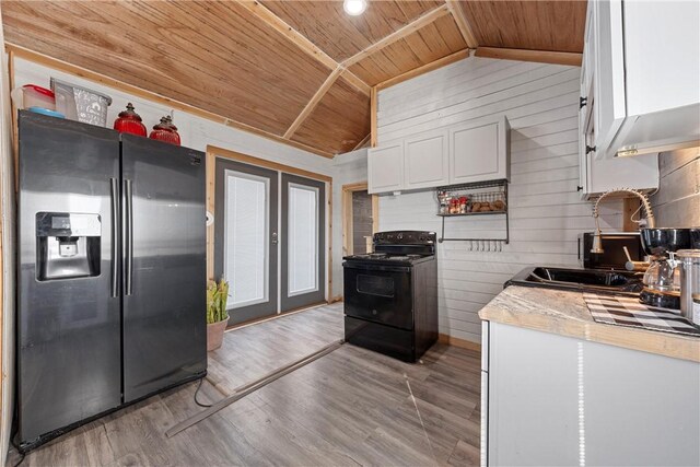 kitchen with vaulted ceiling, white cabinets, electric range, wood ceiling, and stainless steel refrigerator with ice dispenser