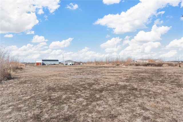 view of yard with a rural view