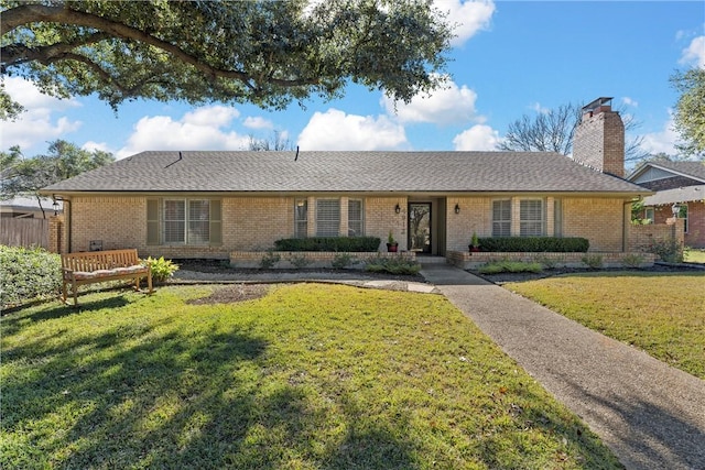 single story home featuring a front lawn