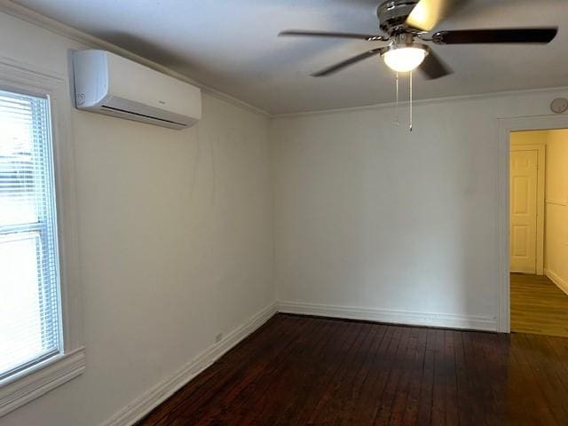 empty room featuring a wall mounted AC, ceiling fan, dark wood-type flooring, and ornamental molding