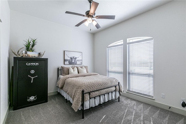 bedroom featuring carpet, ceiling fan, and multiple windows