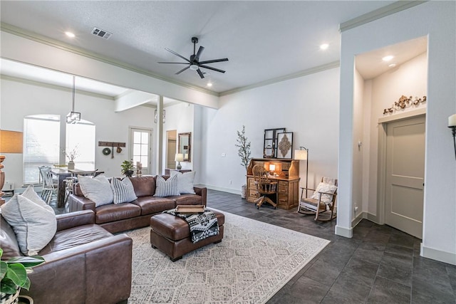 living room featuring ceiling fan and ornamental molding