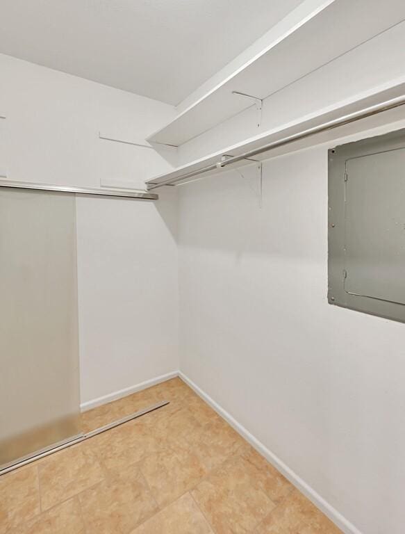 spacious closet featuring electric panel