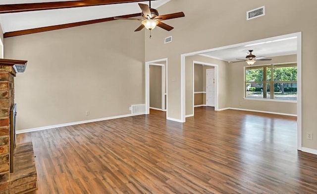 unfurnished living room with vaulted ceiling, ceiling fan, a fireplace, and dark hardwood / wood-style floors