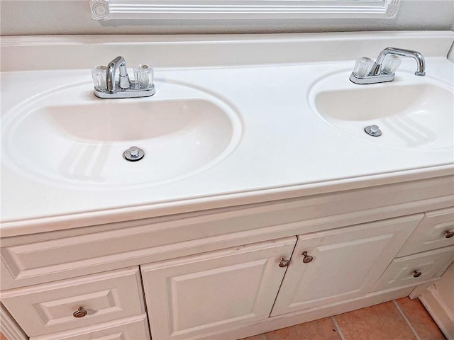 bathroom featuring tile patterned flooring and vanity