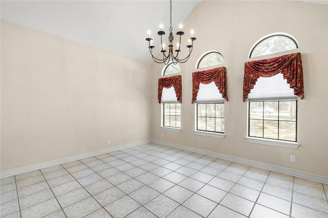 unfurnished dining area featuring plenty of natural light, light tile patterned flooring, high vaulted ceiling, and an inviting chandelier