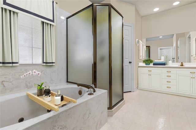 bathroom featuring vanity and plus walk in shower