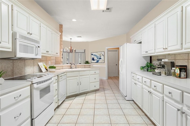 kitchen with backsplash, white cabinetry, pendant lighting, and white appliances