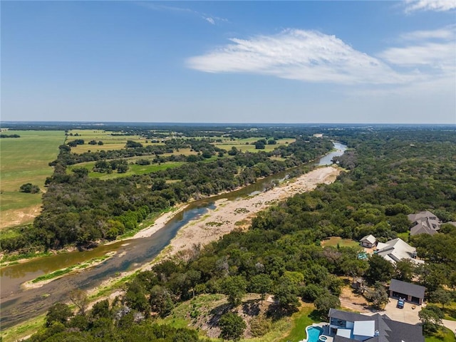 birds eye view of property with a rural view and a water view