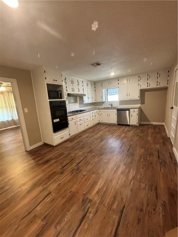 kitchen with white cabinetry, sink, dark wood-type flooring, and black appliances