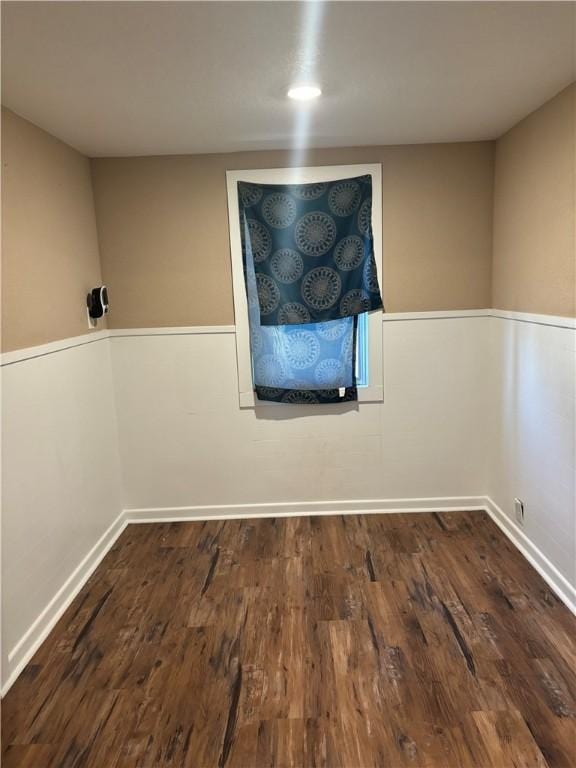 spare room featuring dark hardwood / wood-style floors