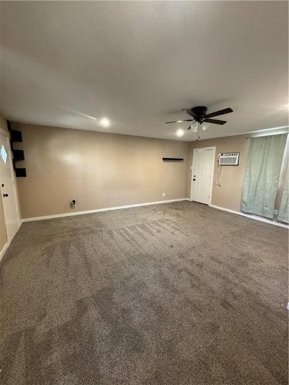 carpeted spare room featuring a wall mounted air conditioner and ceiling fan