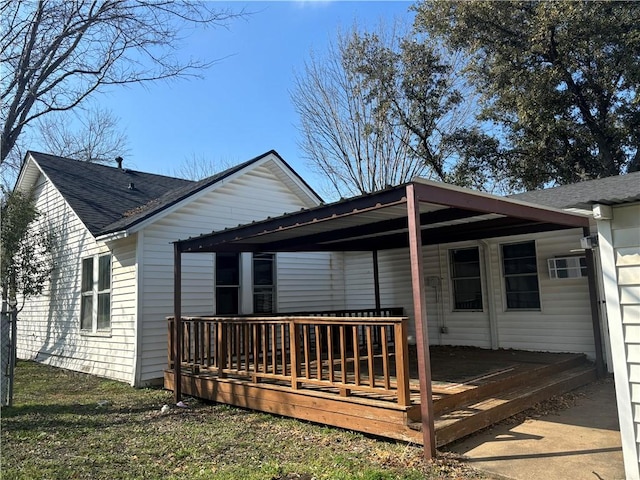 back of house featuring a deck