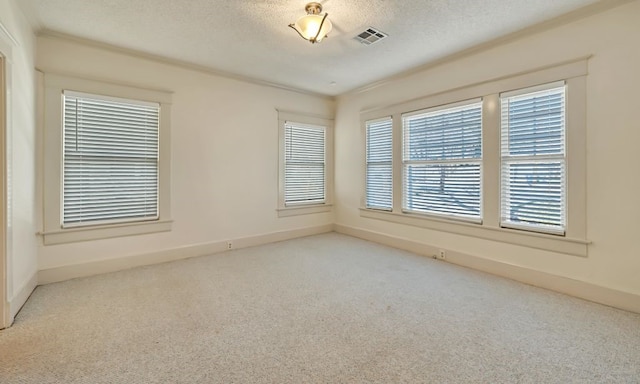 unfurnished room featuring a textured ceiling