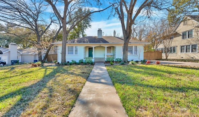 ranch-style house with covered porch and a front lawn