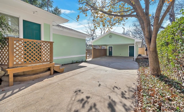 view of side of home with a carport