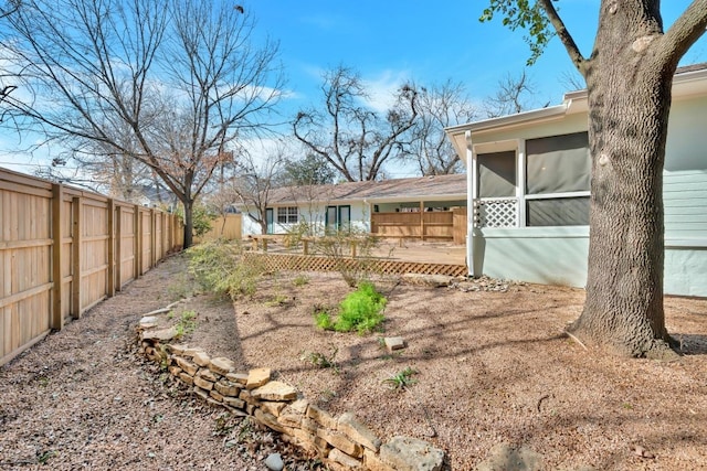 view of yard with a sunroom