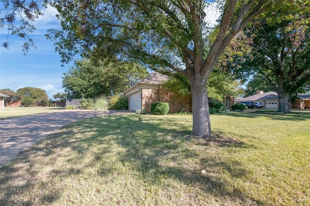 view of yard featuring a garage