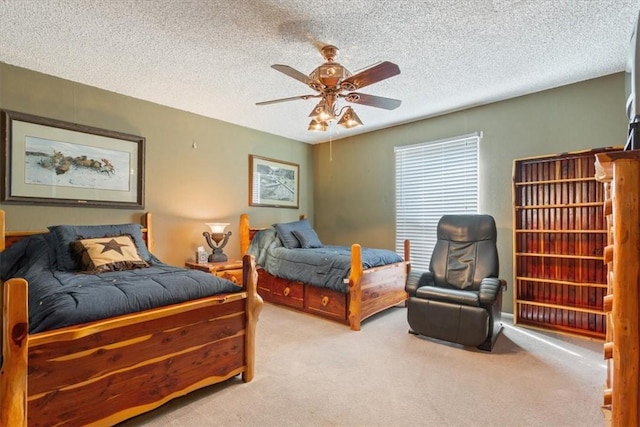 bedroom featuring ceiling fan, light carpet, and a textured ceiling