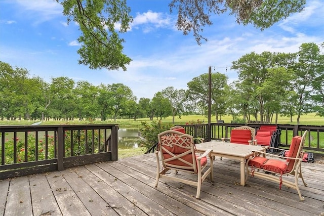 wooden terrace with a water view