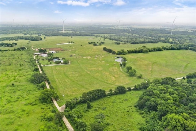 birds eye view of property with a rural view