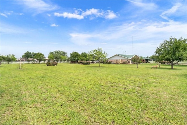 view of yard with a rural view