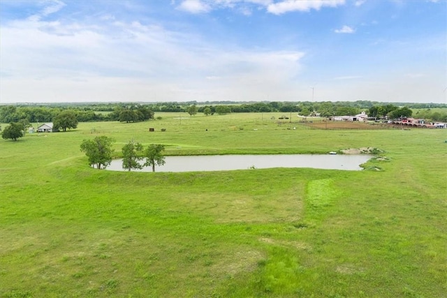 view of community with a rural view and a water view