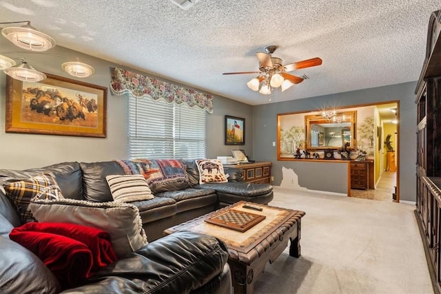 living room featuring ceiling fan, light colored carpet, and a textured ceiling