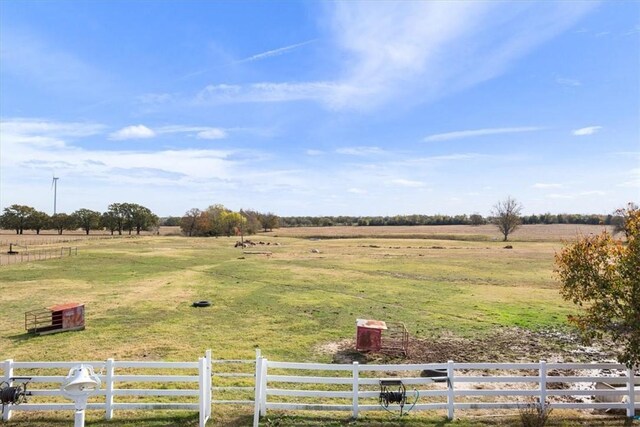 view of yard with a rural view