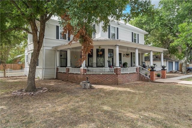 country-style home featuring covered porch