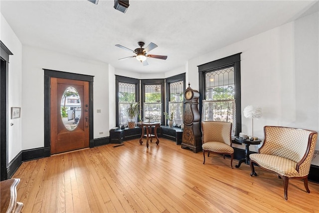 unfurnished room featuring ceiling fan and light wood-type flooring