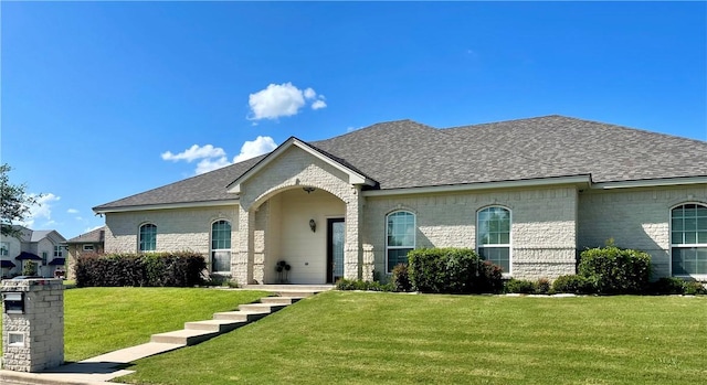 french country home with a front yard