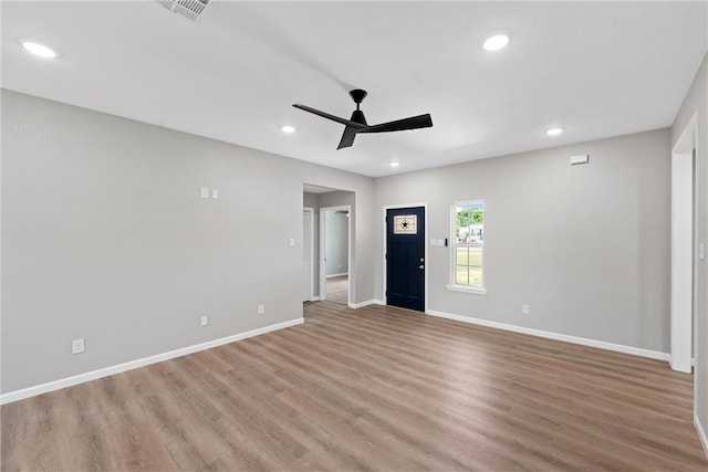 interior space with ceiling fan and light wood-type flooring