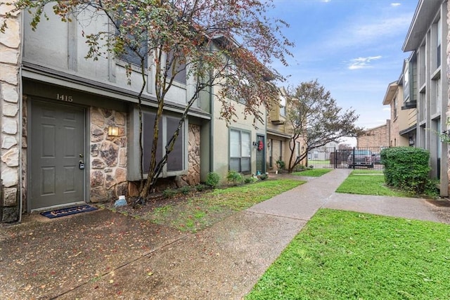 view of home's community with a yard